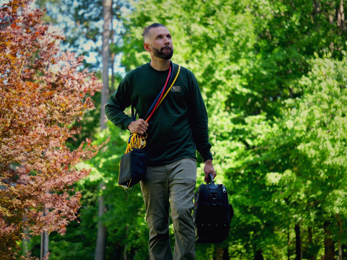 Ighor walking through the woods on the way to a service call