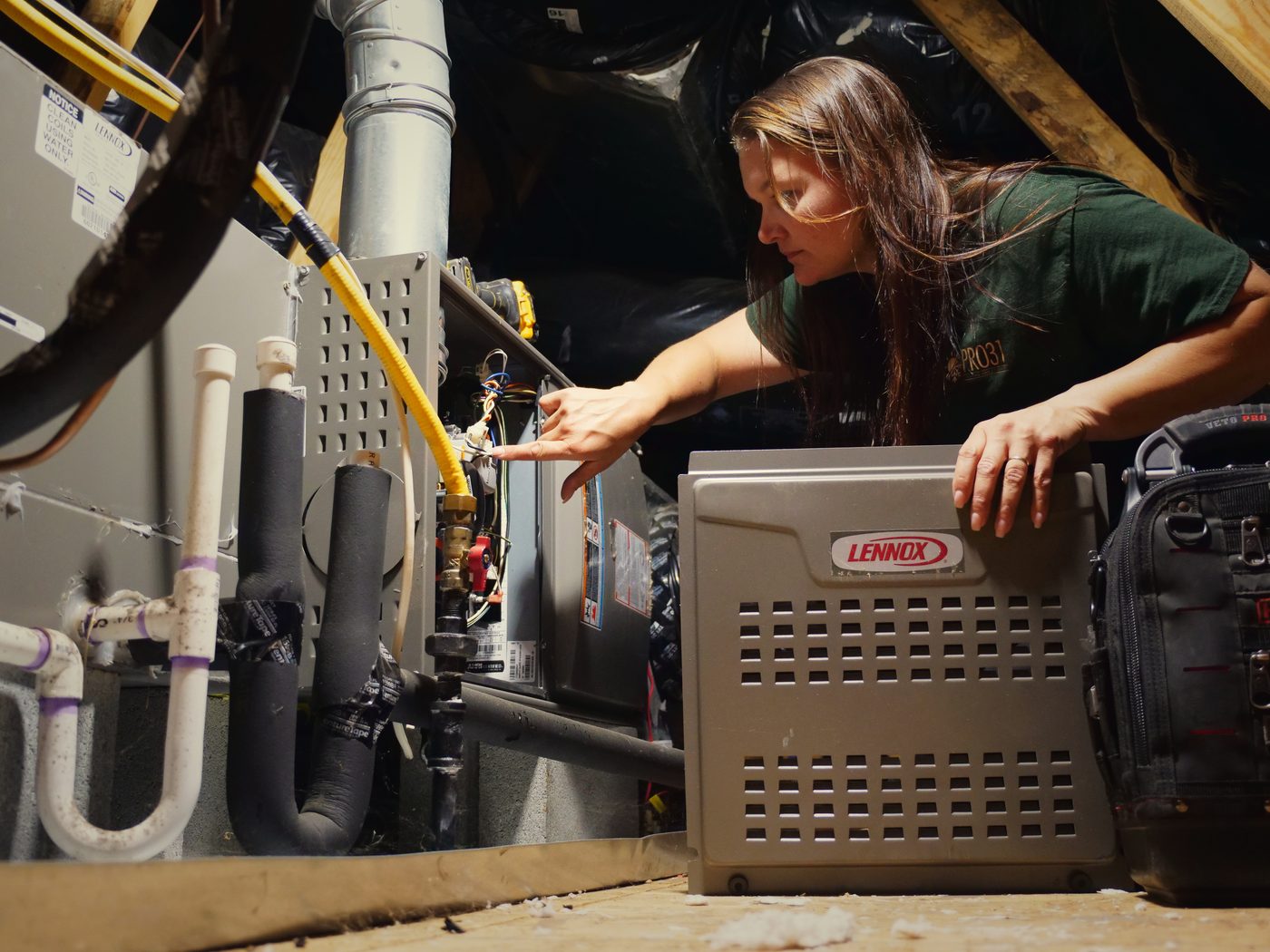 Rachelle installing a Lennox furnace